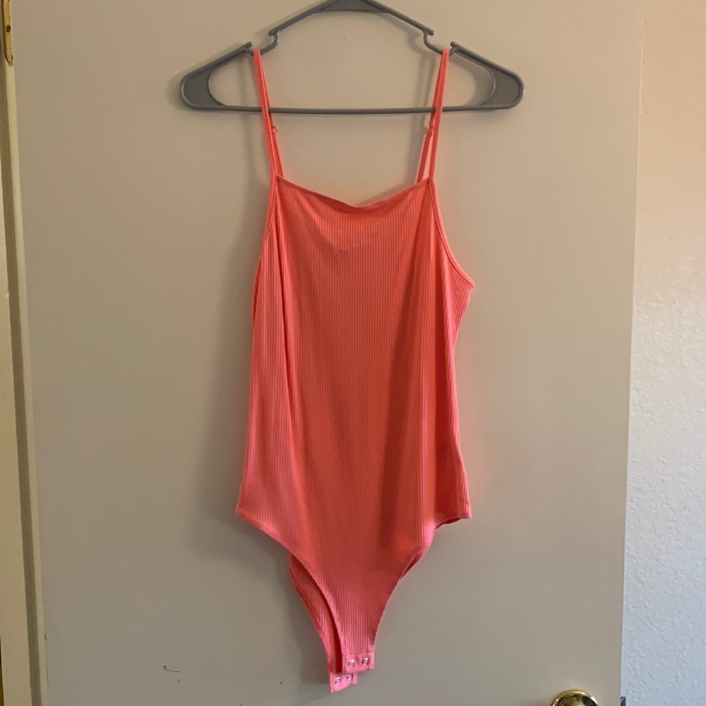 NWT peach body suit